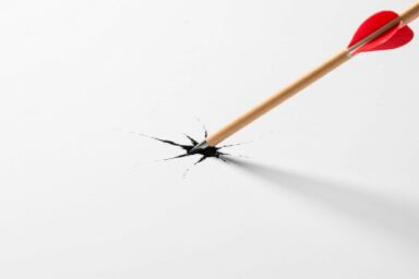Arrow through the paper, depicting piercing, breaking, or aiming accurately, emphasizing precision and impact in a symbolic representation