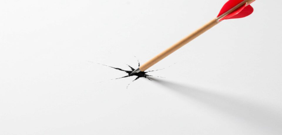 Arrow through the paper, depicting piercing, breaking, or aiming accurately, emphasizing precision and impact in a symbolic representation